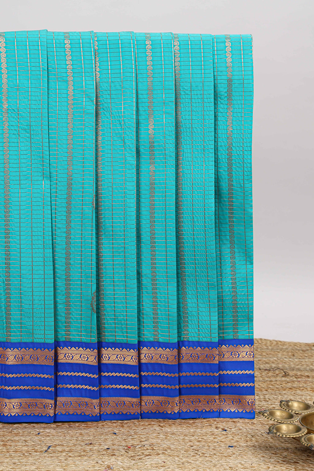 Blue checked zari striped motifs design art silk saree with contrast border and blouse