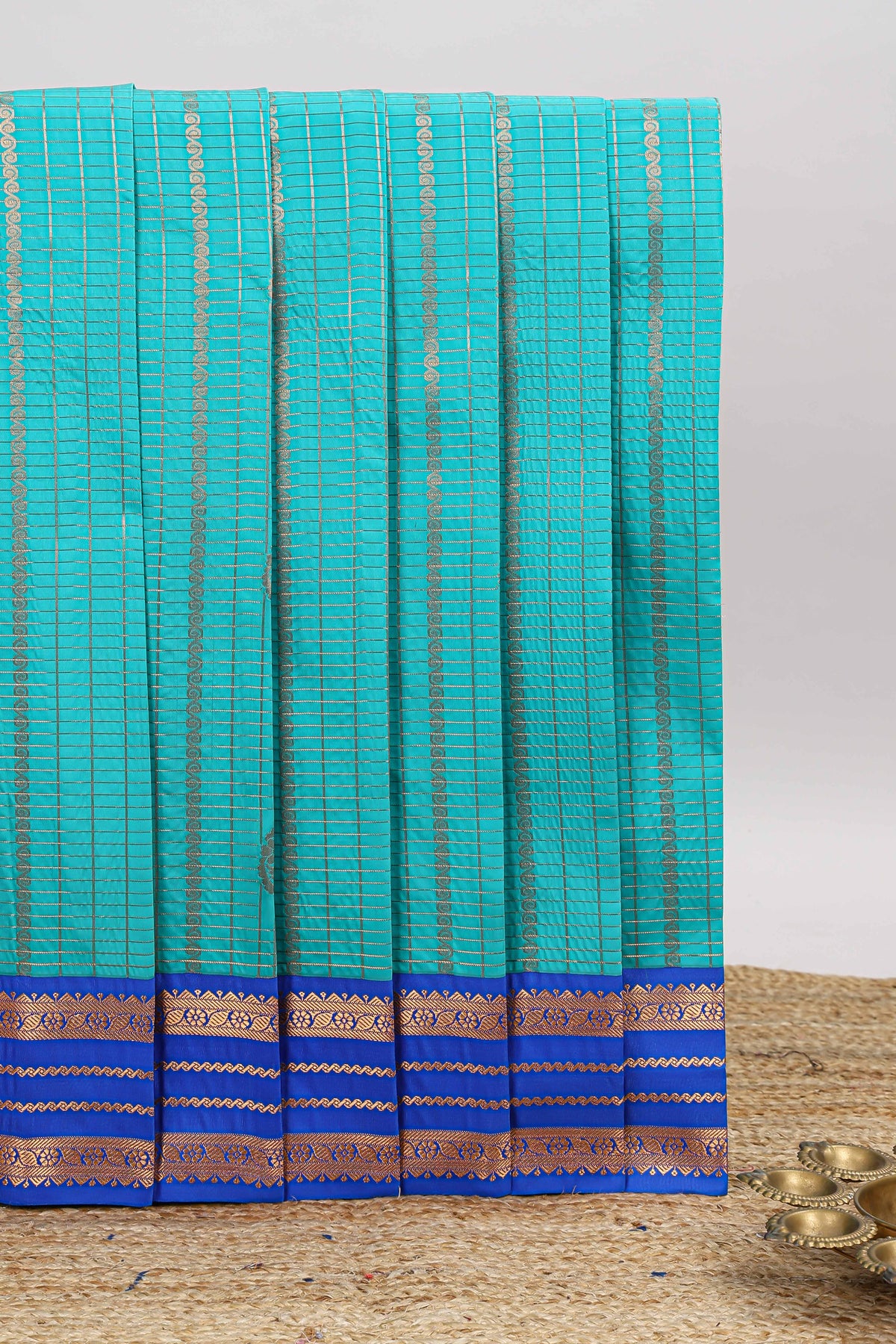 Blue checked zari striped motifs design art silk saree with contrast border and blouse