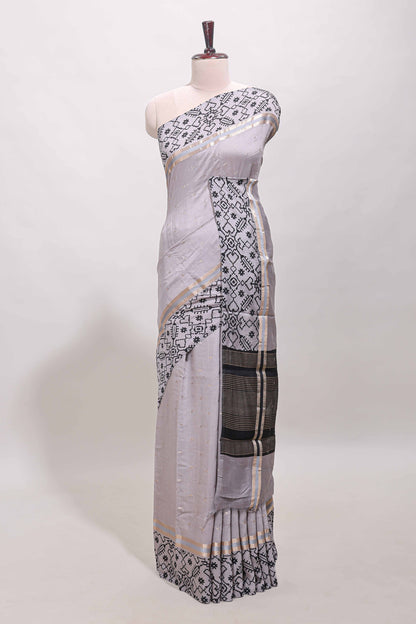 Faded lavender plain assam silk saree eith self ikkat style border and matching blouse