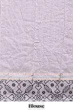 Faded lavender plain assam silk saree eith self ikkat style border and matching blouse