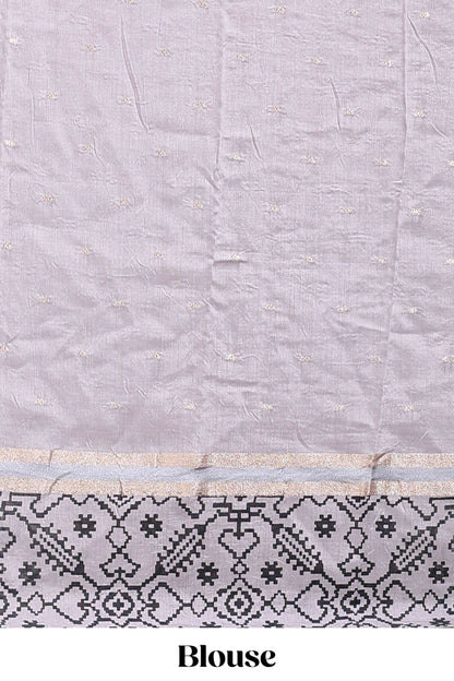 Faded lavender plain assam silk saree eith self ikkat style border and matching blouse