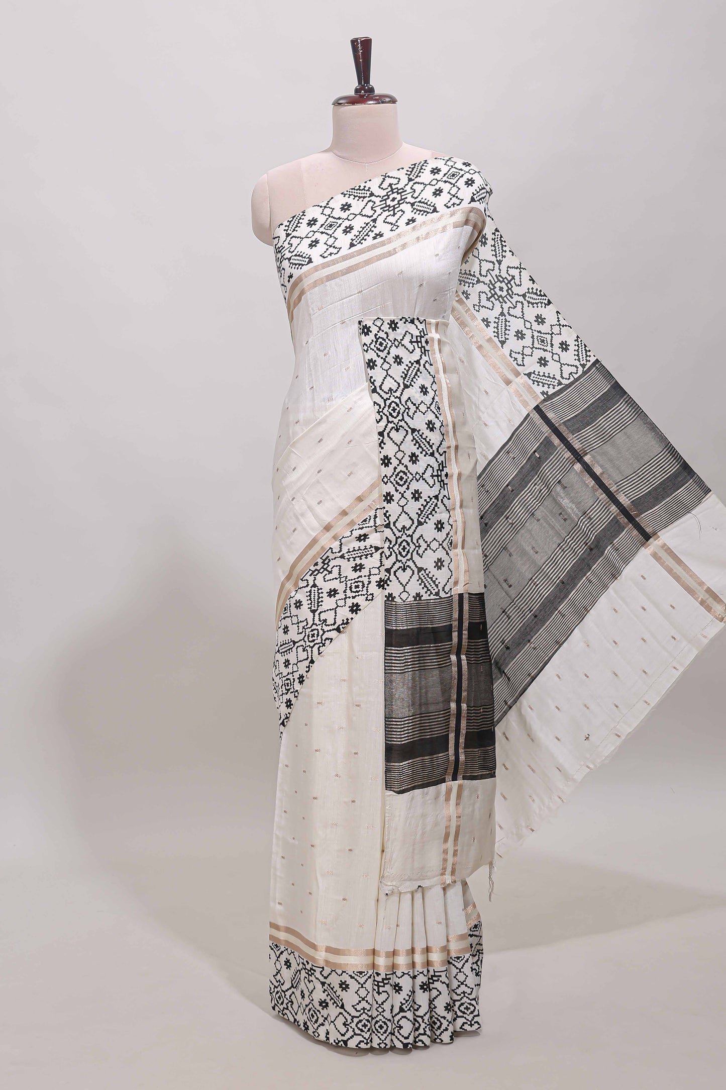 White plain assam silk saree eith self ikkat style border and matching blouse