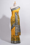 Mustard yellow Assam Silk saree floral and paisley motifs with a rich grey zari border and contrast pallu along with matching blouse