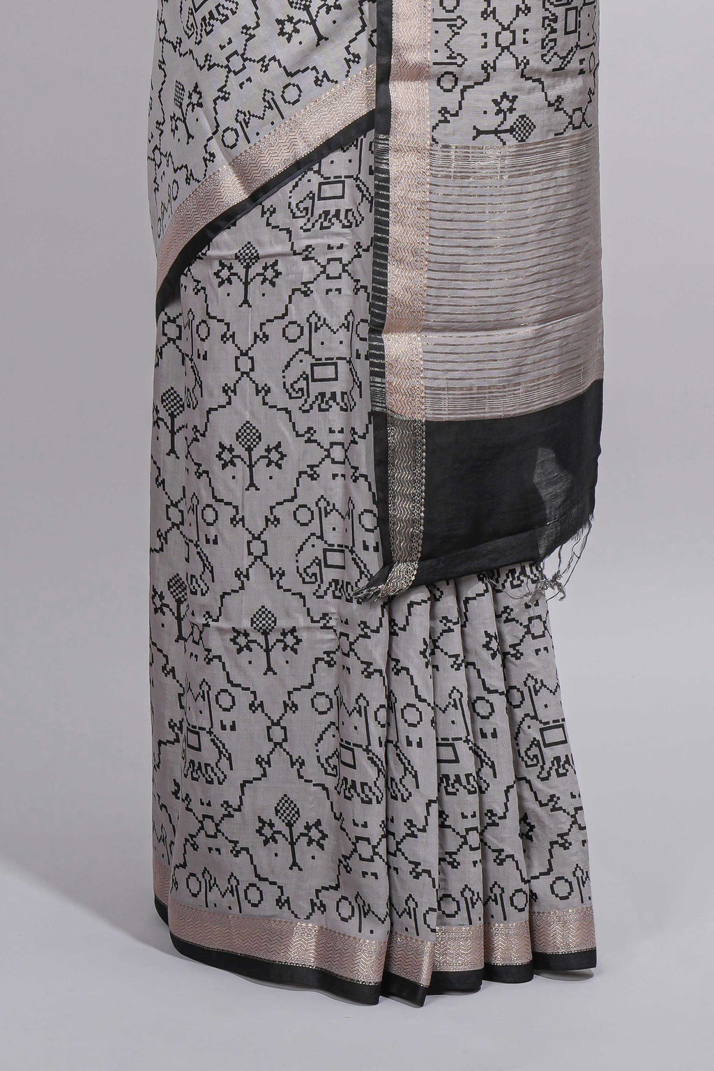 Grey colour Assam Silk saree traditional folk motif print floral patterns and a contrast woven border The detailed pallu along with contrast blouse