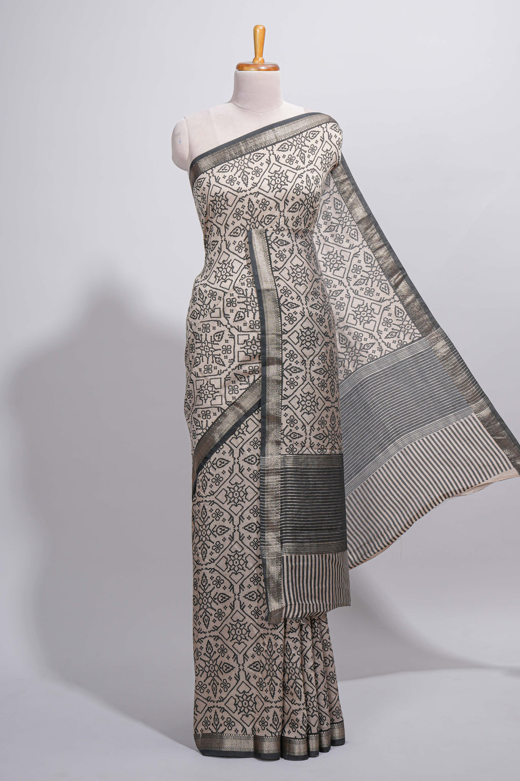 Ivory colour Assam Silk saree traditional folk motif print floral patterns and a contrast woven border The detailed pallu along with contrast blouse
