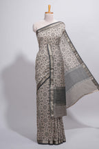 Ivory colour Assam Silk saree traditional folk motif print floral patterns and a contrast woven border The detailed pallu along with contrast blouse