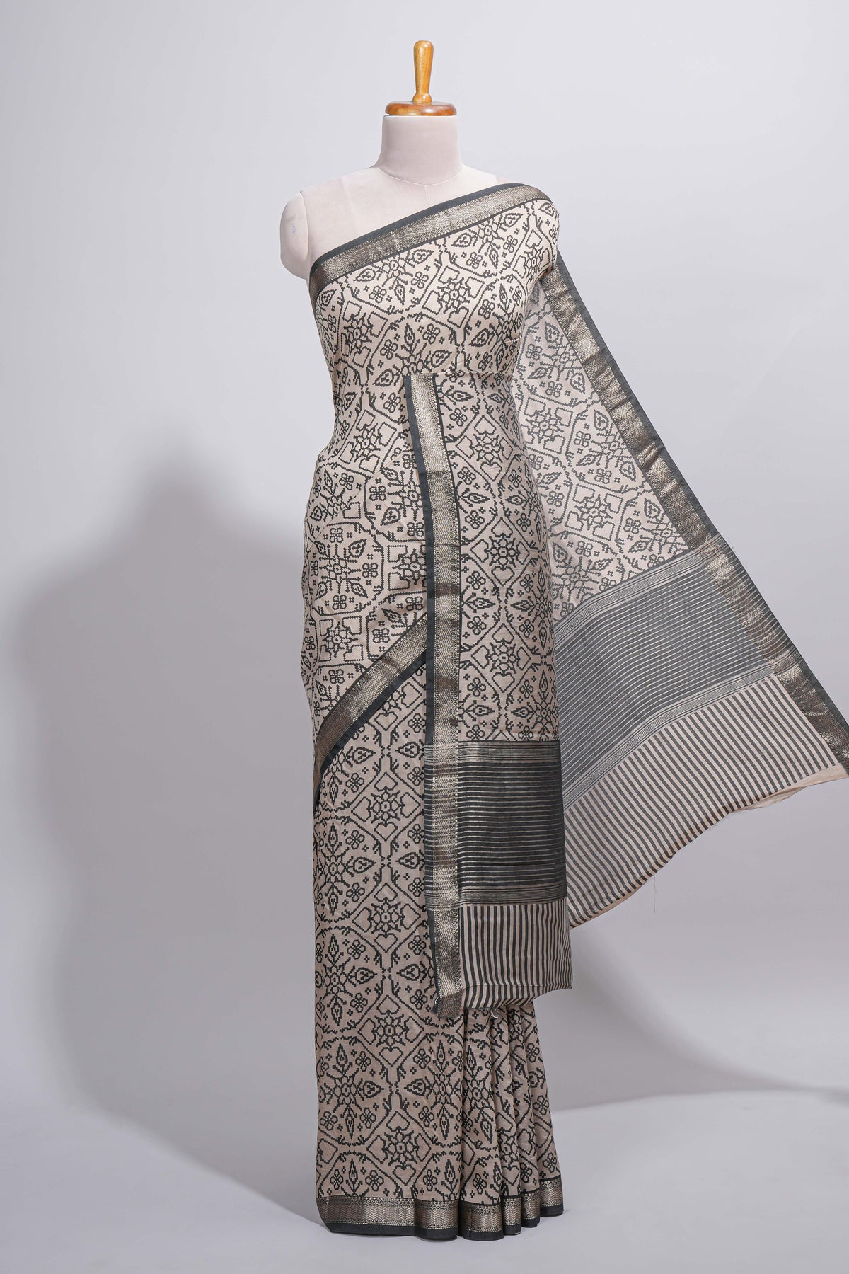Ivory colour Assam Silk saree traditional folk motif print floral patterns and a contrast woven border The detailed pallu along with contrast blouse
