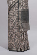 Ivory colour Assam Silk saree traditional folk motif print floral patterns and a contrast woven border The detailed pallu along with contrast blouse