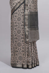 Ivory colour Assam Silk saree traditional folk motif print floral patterns and a contrast woven border The detailed pallu along with contrast blouse