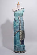 Aqua blue Assam Silk saree with woven patterns floral details contrast navy pallu and zari border along with printed blouse