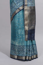Aqua blue Assam Silk saree with woven patterns floral details contrast navy pallu and zari border along with printed blouse