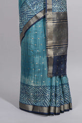 Aqua blue Assam Silk saree with woven patterns floral details contrast navy pallu and zari border along with printed blouse
