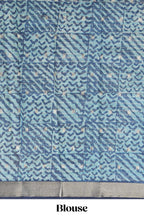 Aqua blue Assam Silk saree with woven patterns floral details contrast navy pallu and zari border along with printed blouse