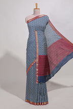 Navy blue geometric print  assam silk saree with  zari border and matching blouse