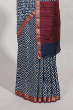 Navy blue geometric print  assam silk saree with  zari border and matching blouse