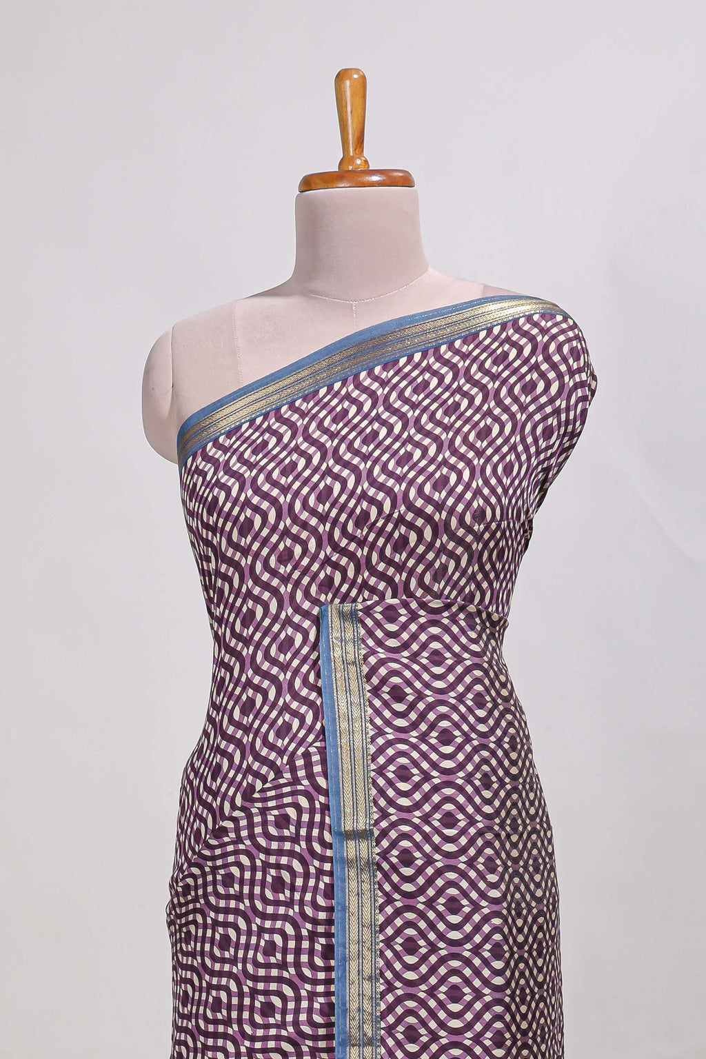 Violet geometric print  assam silk saree with  zari border and matching blouse
