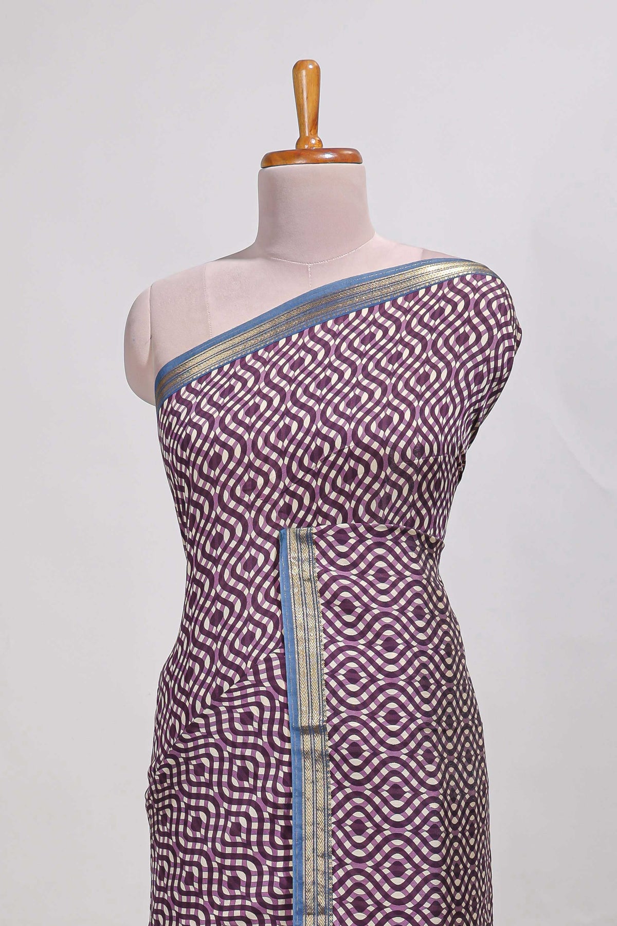 Violet geometric print  assam silk saree with  zari border and matching blouse