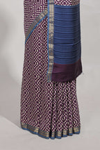 Violet geometric print  assam silk saree with  zari border and matching blouse