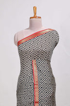 Grey geometric print  assam silk saree with  zari border and matching blouse