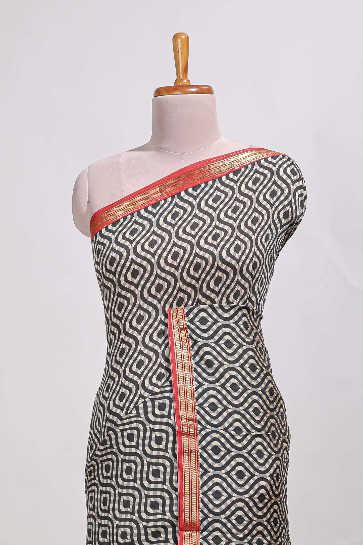 Grey geometric print  assam silk saree with  zari border and matching blouse