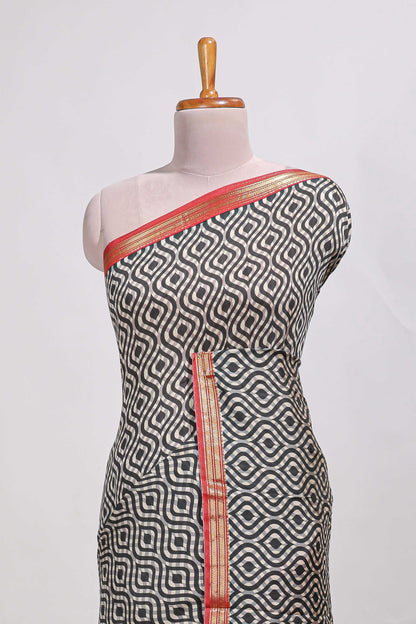 Grey geometric print  assam silk saree with  zari border and matching blouse