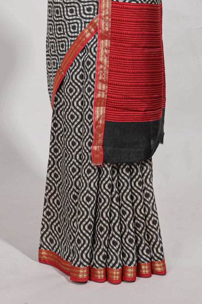 Grey geometric print  assam silk saree with  zari border and matching blouse
