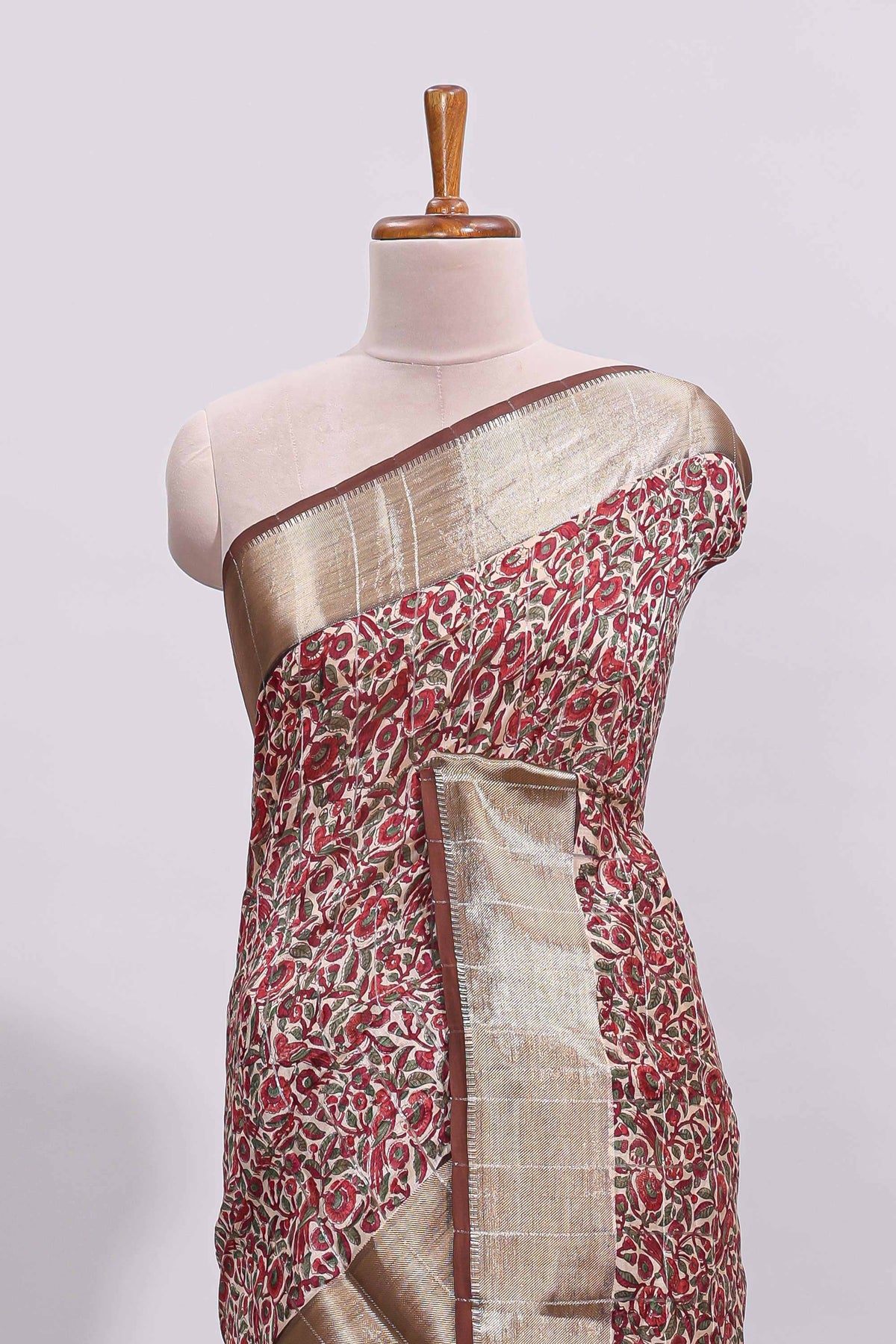 Beige checked floral design assam silk saree with contrast zari border and printed blouse