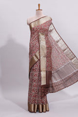 Beige checked floral design assam silk saree with contrast zari border and printed blouse