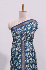 Blue floral design assam silk saree with self zari border and striped blouse