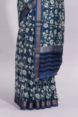 Blue floral design assam silk saree with self zari border and striped blouse