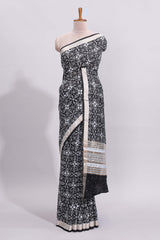 Black ikkat style floral design assam silk saree with self zari border and matching motifs blouse