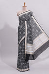 Black ikkat style floral design assam silk saree with self zari border and matching motifs blouse