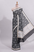 Black ikkat style floral design assam silk saree with self zari border and matching motifs blouse