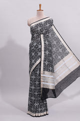Black ikkat style floral design assam silk saree with self zari border and matching motifs blouse