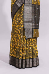 Yellow floral design assam silk saree with contrast zari border and matching motifs blouse