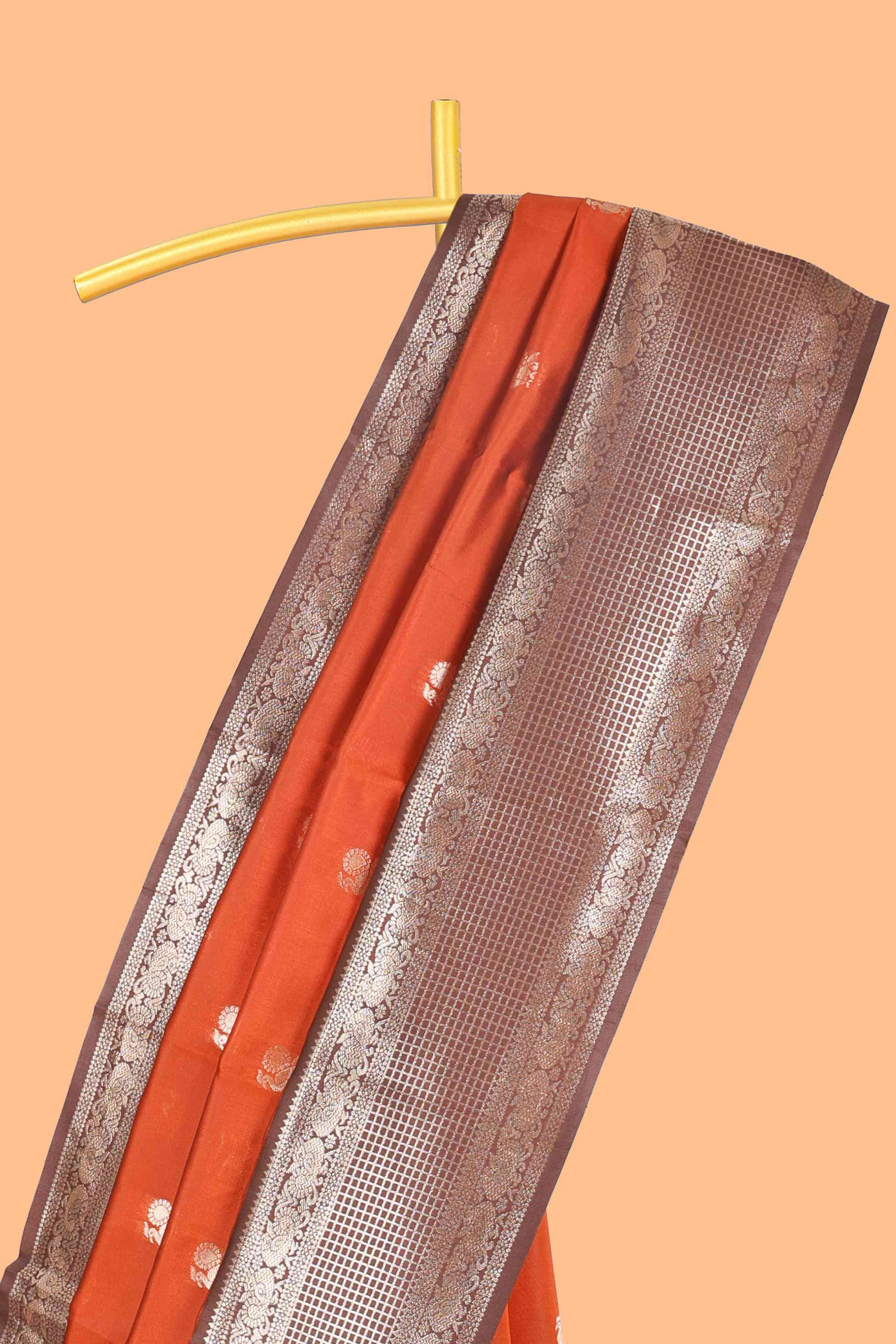 Rust orange peacock zari motifs design semi soft silk saree with contrast zari border and pallu