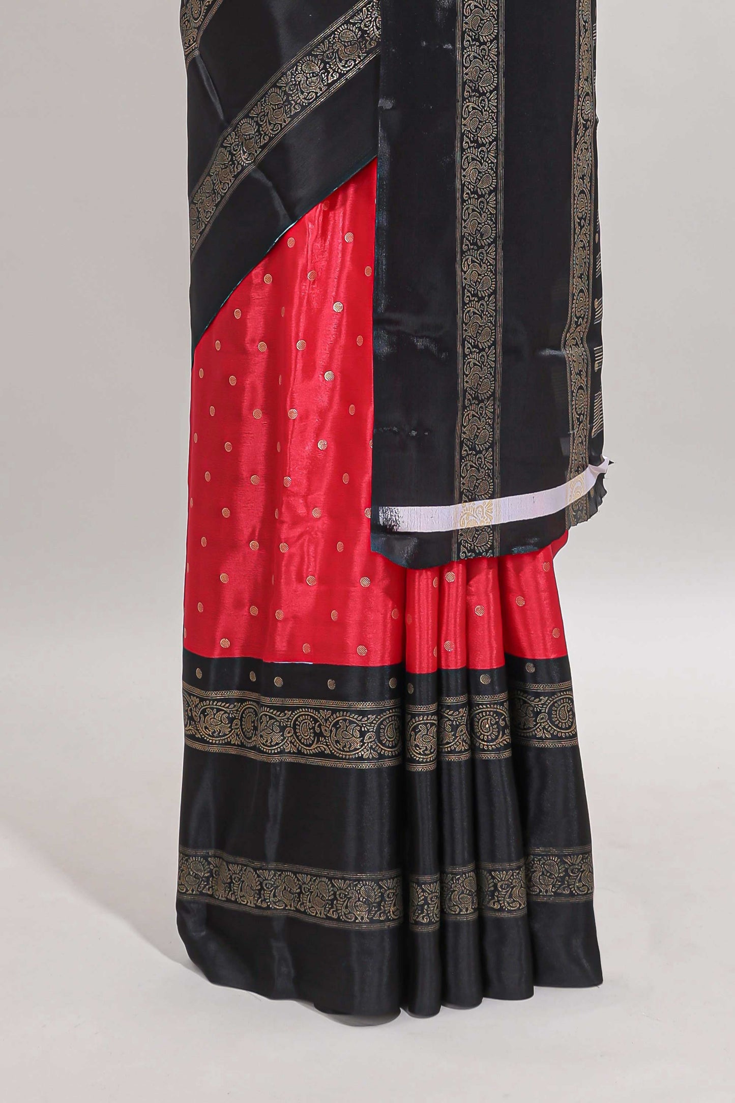 Red zari butta semi soft silk saree with contrast black bentex border and zari striped pallu