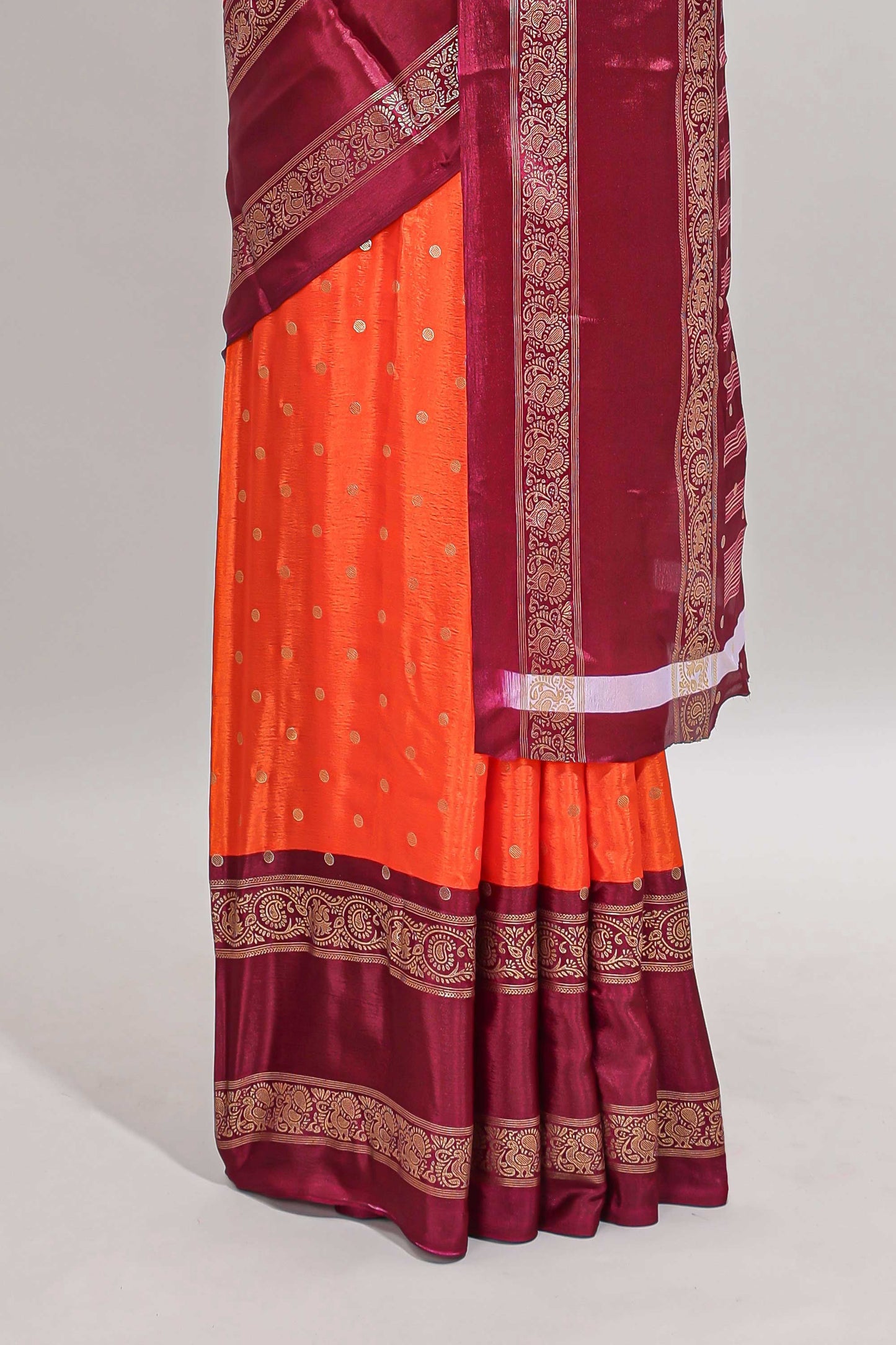 Orange zari butta semi soft silk saree with contrast bentex border and zari striped pallu