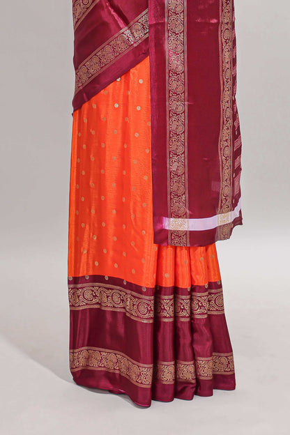 Orange zari butta semi soft silk saree with contrast bentex border and zari striped pallu