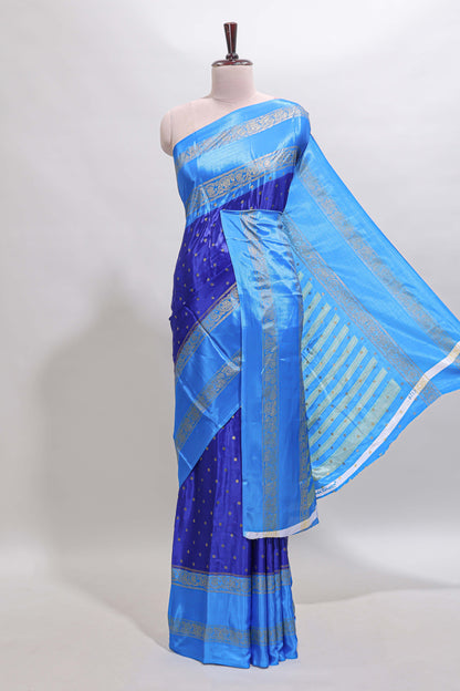 Blue zari butta semi soft silk saree with contrast bentex border and zari striped pallu