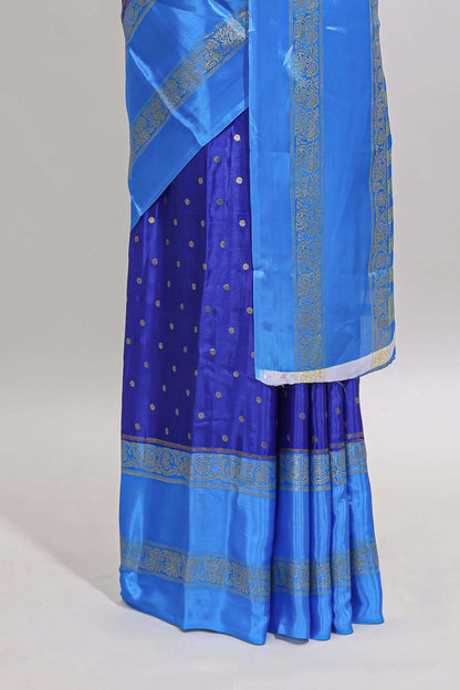 Blue zari butta semi soft silk saree with contrast bentex border and zari striped pallu