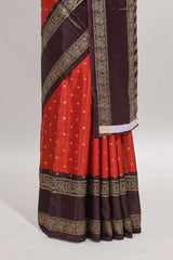 Deep orange zari butta semi soft silk saree with contrast bentex border and zari striped pallu