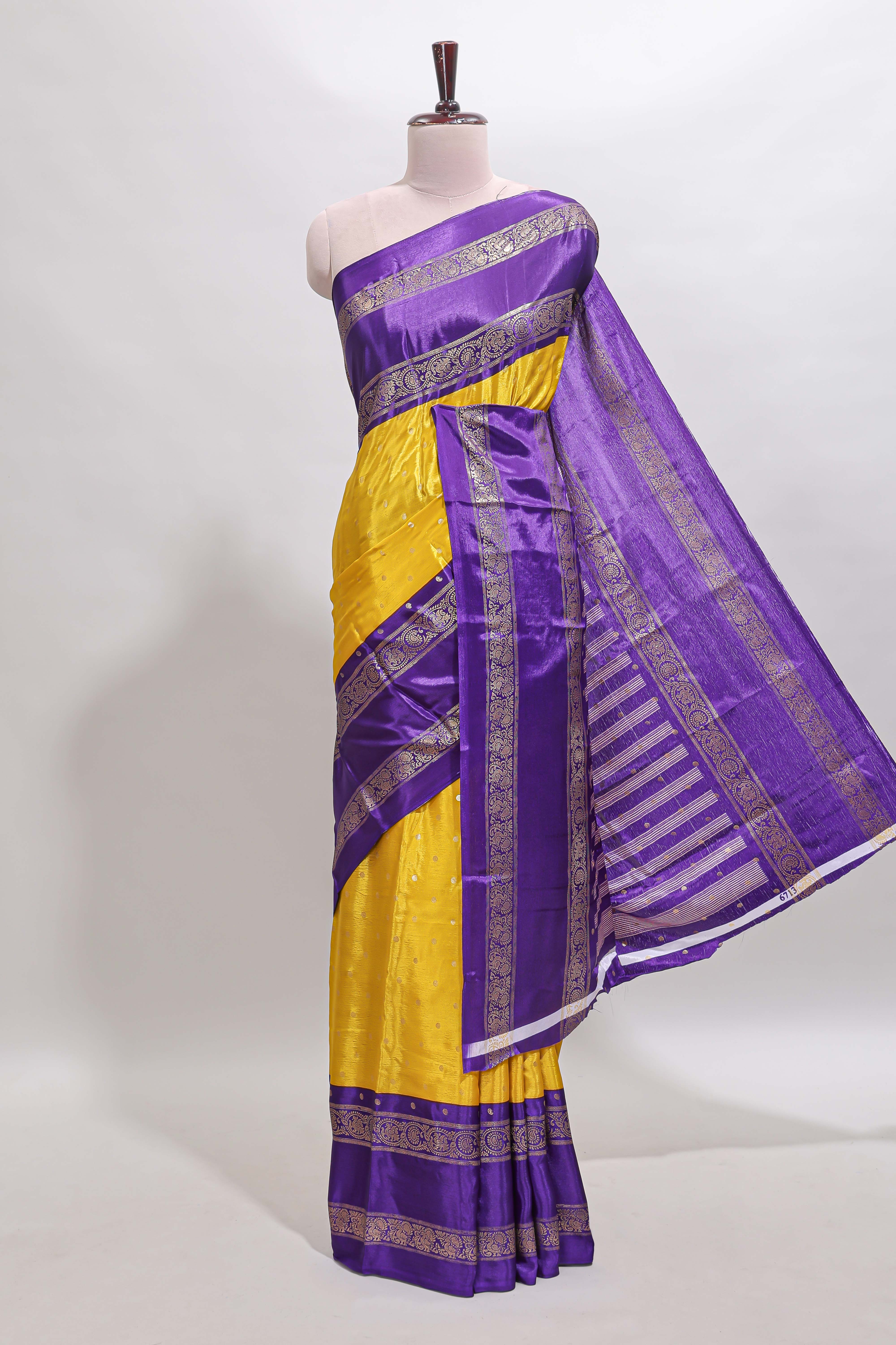 Yellow zari butta semi soft silk saree with contrast bentex border and zari striped pallu