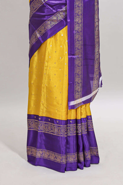 Yellow zari butta semi soft silk saree with contrast bentex border and zari striped pallu