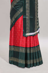 Red zari butta semi soft silk saree with contrast green bentex border and zari striped pallu