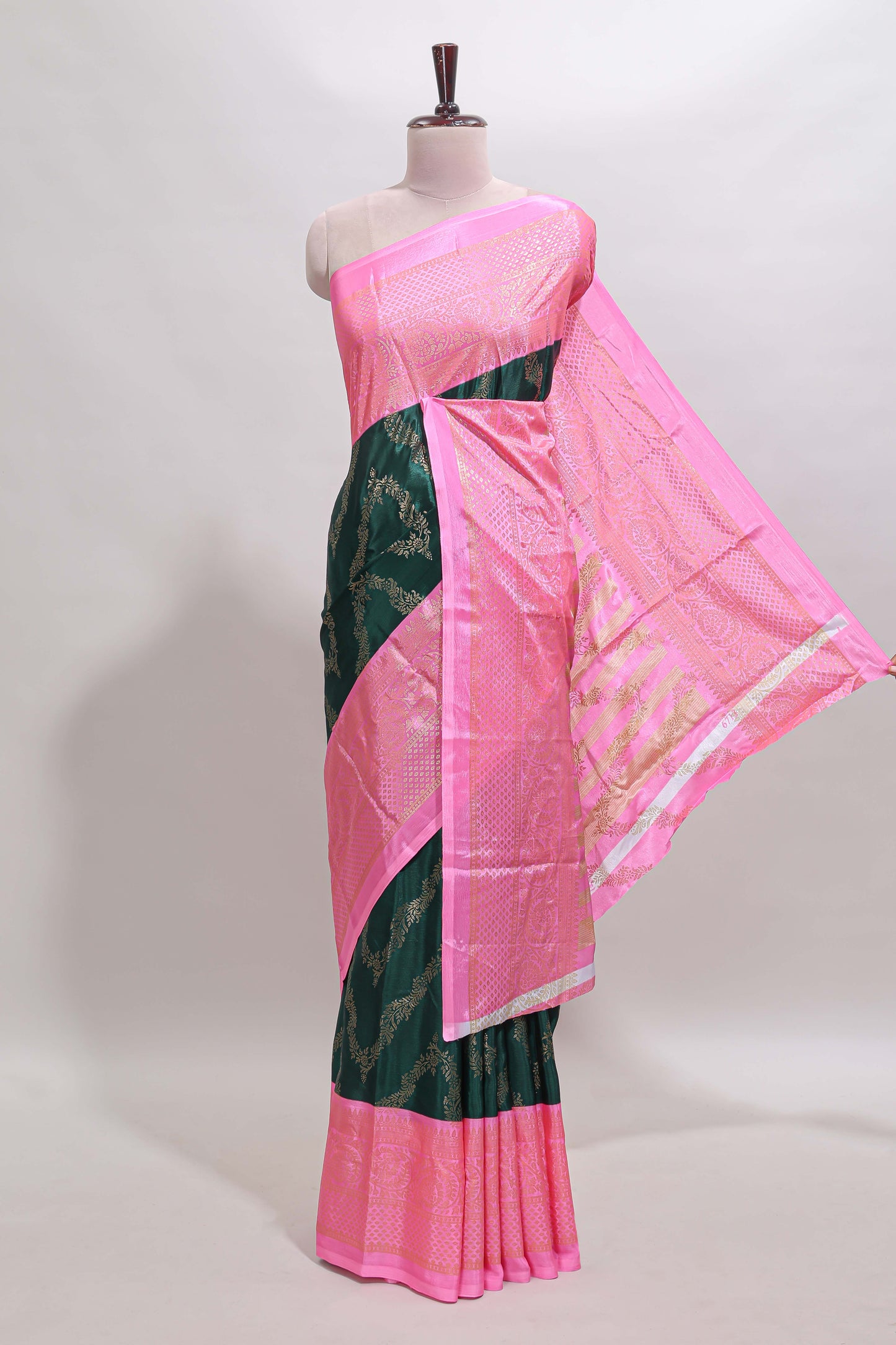 Green floral vine chevron design semi soft silk saree with contrast zari border and striped pallu