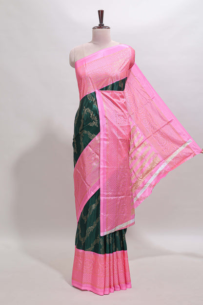 Green floral vine chevron design semi soft silk saree with contrast zari border and striped pallu