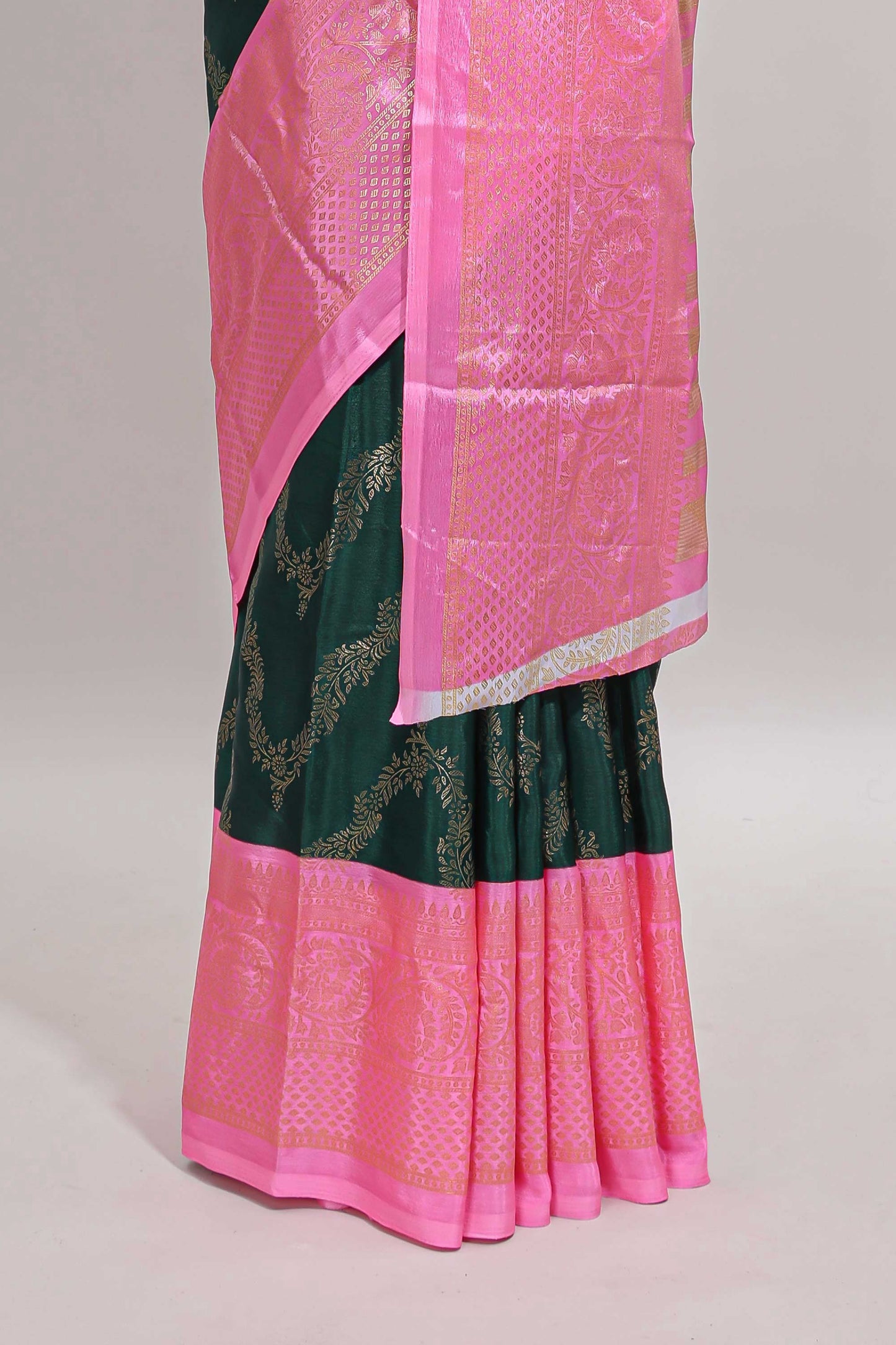 Green floral vine chevron design semi soft silk saree with contrast zari border and striped pallu