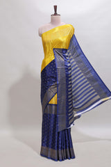 Yellow & blue dual shade zari motifs semi soft silk saree with self border and striped pallu