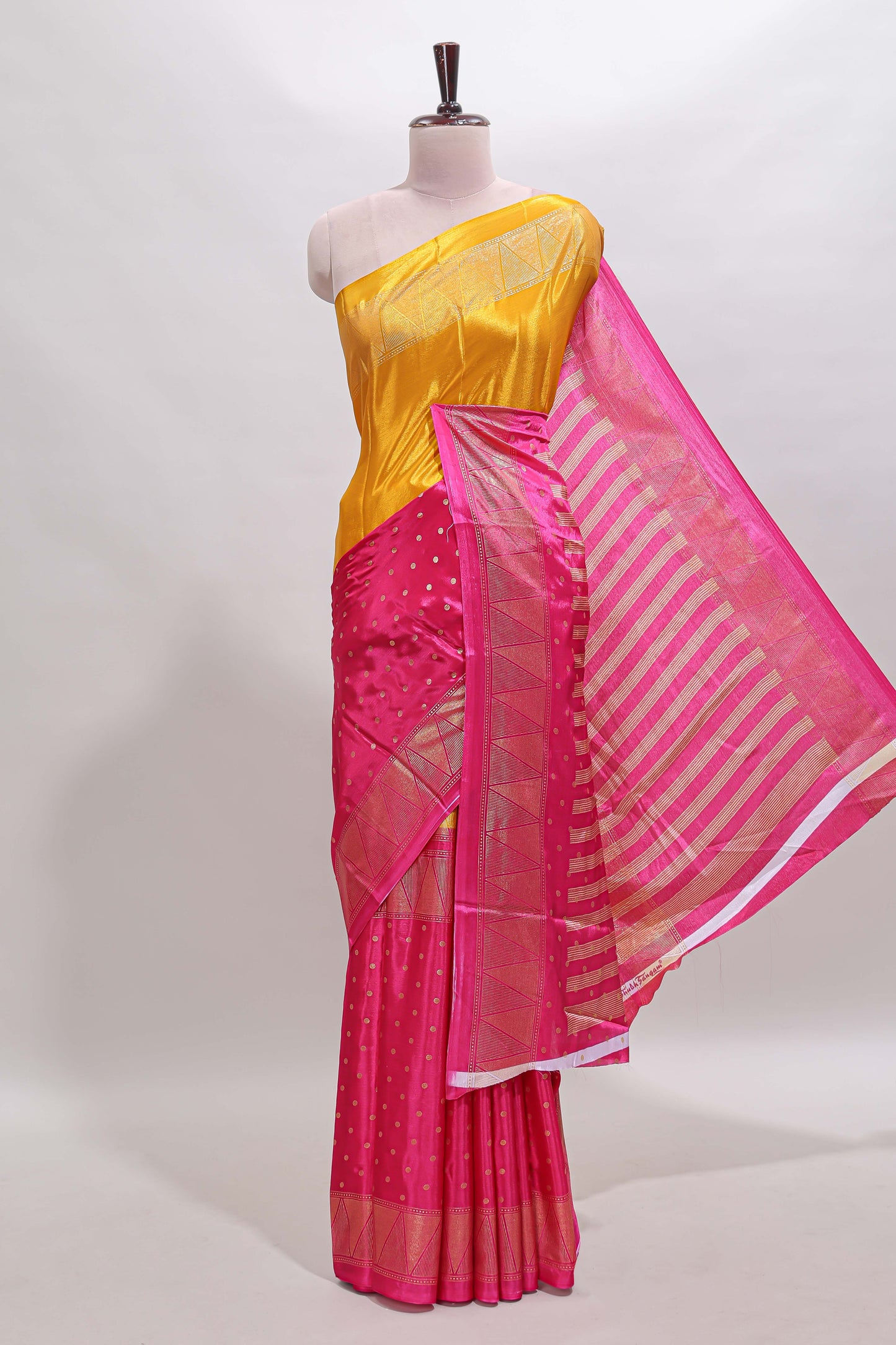 Mustard & pink dual shade zari motifs semi soft silk saree with self border and striped pallu